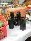 A cased pair of binoculars