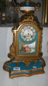 A French gilt clock with Sevres porcelain panels