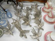 A collection of silver plated fighting cocks