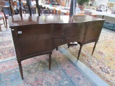 A good quality mahogany serpentine front sideboard