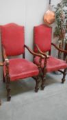 A pair of oak framed arm chairs