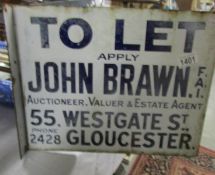 A double sided John Brawn Auctioneer/Estate agents sign