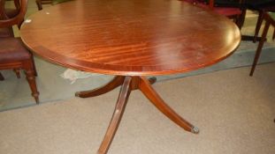 A circular mahogany table