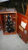 An early 20th century cased microscope
