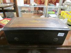 A Victorian music box playing 8 tunes, in good condition with all teeth and pins intact,