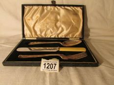 A cased 3 piece cutlery set comprising a silver fork,