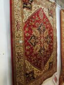 A red ground Heriz rug,