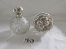 A silver topped scent bottle,