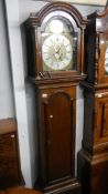 An 8 day Grandfather clock with brass dial