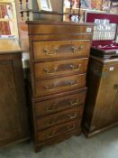 A 20th century 6 drawer chest with string inlay and brass drop handles, height 108cm,