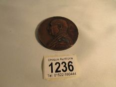 A bronze medallion marked Josef Sachs,