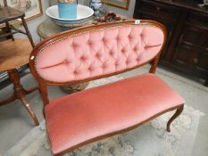 A late 20th century Queen Anne style 2 seat bedroom couch