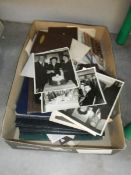 A box of old photographs etc