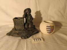 A Carlton ware match striker and a Victorian spelter match striker