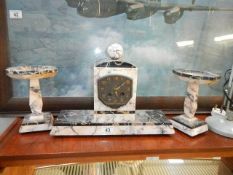 An Art Deco French marble clock garniture