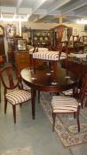 A good quality Regency style dining table with 3 extra leaves and 6 dining chairs