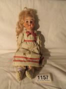 A 19th century German bisque headed doll