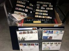 A box containing a large quantity of UK and world stamps,