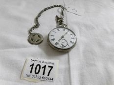 A silver pocket watch 1859/60, working but dial a/f, complete with key,