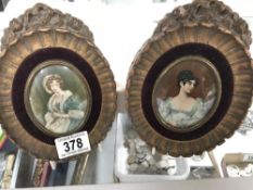 A pair of framed and glazed miniature portrait prints