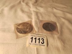 A 1780 Maria Theresia Austrian silver coin and an 1896 Tsar Nicholas II silver coin