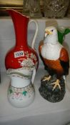 An unusual Crown Devon flame red ewer, a Doulton fish eagle decanter,