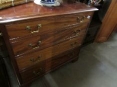 A mahogany 4 drawer chest on bracket feet and with brass drop handles, height 83 cm,
