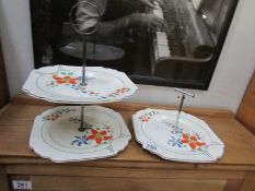 A two tier china cake stand and a matching single cake stand