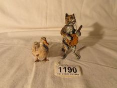 A 19th century nodding head cat musician and a metal footed duck