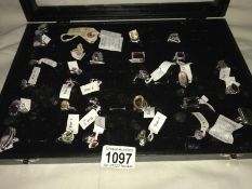 A display case containing 28 925 silver rings set with gems/stones