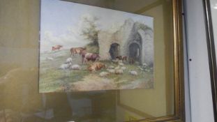 A framed and glazed watercolour 'Sheep and cattle at Abbey ruins' signed J T Burgess 1907.