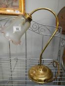 A brass swan neck reading lamp with glass shade and a table lamp with glass shade