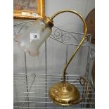 A brass swan neck reading lamp with glass shade and a table lamp with glass shade