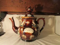 A Victorian barge ware teapot inscribed 'God Bless our Home', 32cm tall,