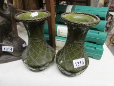 A pair of Japanese green glazed vases