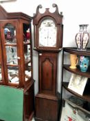 An 8 day painted dial long case clock marked Unwin & Holt,