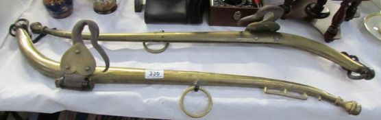 A pair of brass horse hames