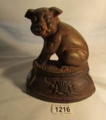 A cast iron pig doorstop with crest