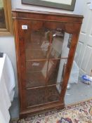 A superb quality walnut display cabinet