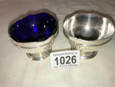 A pair of silver salts (one with blue glass liner) by Mappin & Webb, hall marked Sheffield 1915/16,