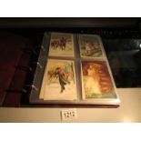 An album of approximately 160 assorted postcards including humorous, royalty, military, animal,