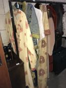 A quantity of vintage and reproduction clothing including 1880's style day jacket with skirt,