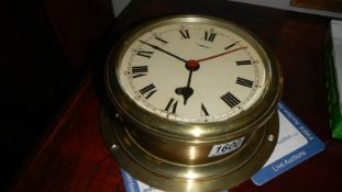 An Elliot of Croydon ship's clock with fittings