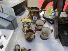 3 19th century lustre jugs and 2 mugs