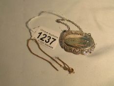 A silver 'Sherry' decanter label hall marked Birmingham 1980 and a 9ct gold chain a/f