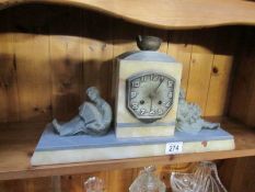 An art Deco French marble clock surmounted figures