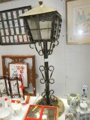 A metal garden lantern on stand