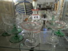 A liquor decanter with glasses and 6 sundae dishes