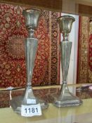 A pair of silver candlesticks