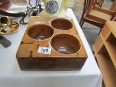 A wooden post office coin tray